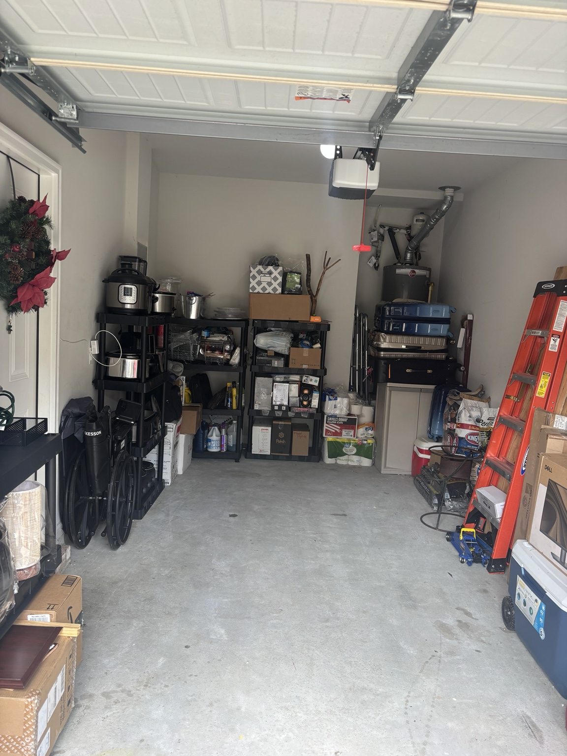 Garage after organization with open floor space and items neatly arranged on shelving