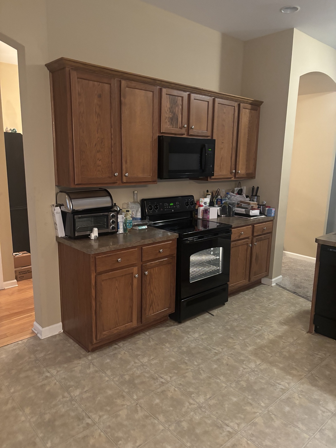 Kitchen after cleaning with counters cleared and appliances refreshed