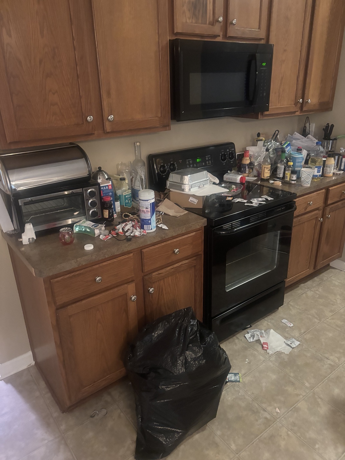 Kitchen counters and stove area before cleaning